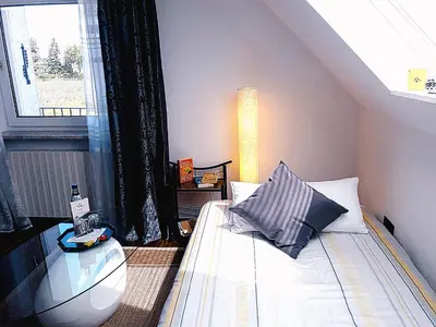 Ein Bett oder Betten in einem Zimmer der Unterkunft GÄSTEHAUS LIFESTYLE