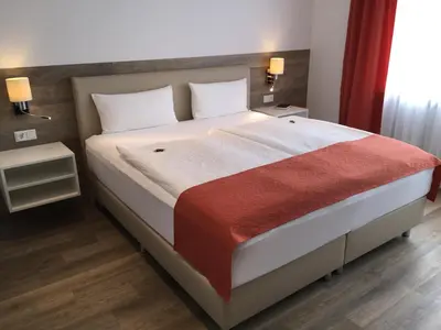 Ein Bett oder Betten in einem Zimmer der Unterkunft Pension Haus Erika