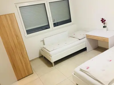 Ein Bett oder Betten in einem Zimmer der Unterkunft China-Restaurant Lin Garden