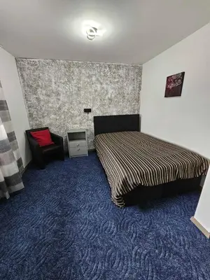 Ein Bett oder Betten in einem Zimmer der Unterkunft Kompfort Business Apartment
