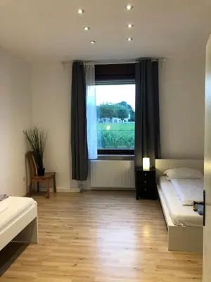 Ein Bett oder Betten in einem Zimmer der Unterkunft Monteurwohnung am Weinberg