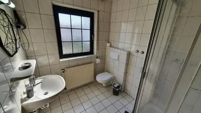 Ein Badezimmer in der Unterkunft Prestige Bistro & Pension