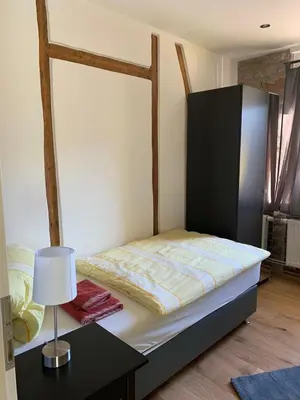 Ein Bett oder Betten in einem Zimmer der Unterkunft Gästehaus Windheim (Ettlingen)