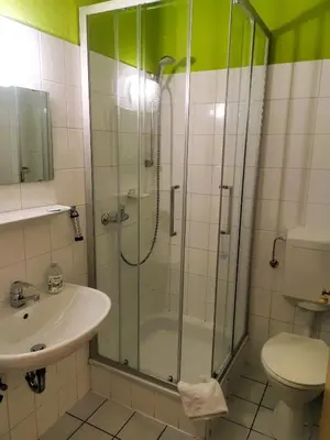 Ein Badezimmer in der Unterkunft Hotel Arheilger Hof
