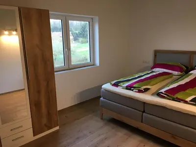 Ein Bett oder Betten in einem Zimmer der Unterkunft Ferienwohung Hirsch