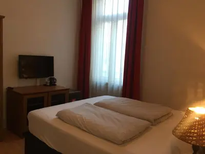 Ein Bett oder Betten in einem Zimmer der Unterkunft The Dubliner Hotel & Irish Pub
