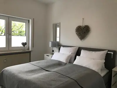 Ein Bett oder Betten in einem Zimmer der Unterkunft xxl Apartment Sinsheim