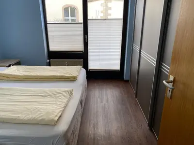 Ein Bett oder Betten in einem Zimmer der Unterkunft Marktschänke