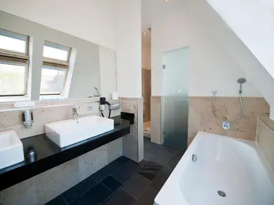 Ein Badezimmer in der Unterkunft Qube Hotel Bergheim