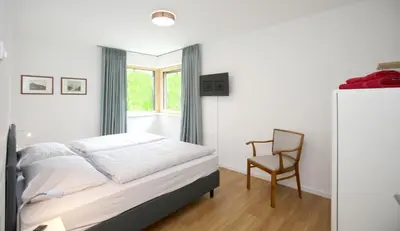 Ein Bett oder Betten in einem Zimmer der Unterkunft Ferienhaus Münzberg