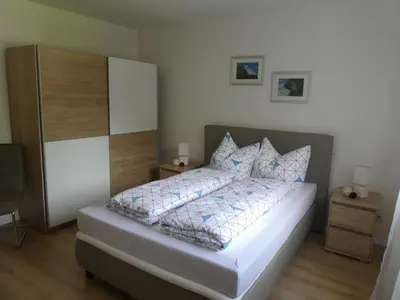 Ein Bett oder Betten in einem Zimmer der Unterkunft Ferienwohnung Mainz-Weisenau
