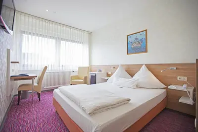 Ein Bett oder Betten in einem Zimmer der Unterkunft Am Bismarck