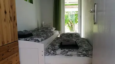Ein Bett oder Betten in einem Zimmer der Unterkunft Ferienhaus Glücksmoment