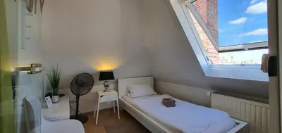Ein Bett oder Betten in einem Zimmer der Unterkunft coLodging Mannheim - private rooms & kitchen