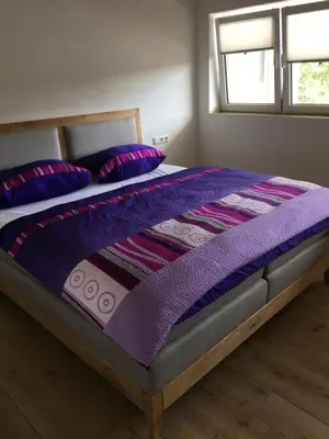 Ein Bett oder Betten in einem Zimmer der Unterkunft Pferd