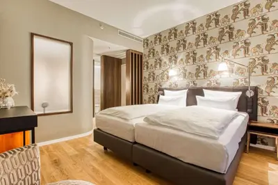 Ein Bett oder Betten in einem Zimmer der Unterkunft Parkhotel Heilbronn