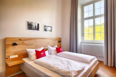 Ein Bett oder Betten in einem Zimmer der Unterkunft Schlosshotel Horneck
