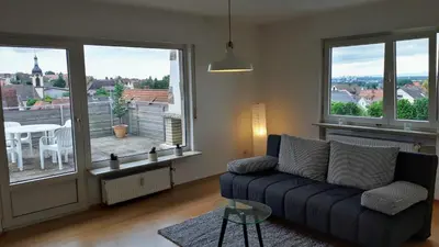 Ein Sitzbereich in der Unterkunft Ferienwohnung Weinheim Stadler
