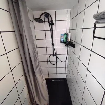 Ein Badezimmer in der Unterkunft Klimatisiertes Ferienhaus am Bauleuteweg 25