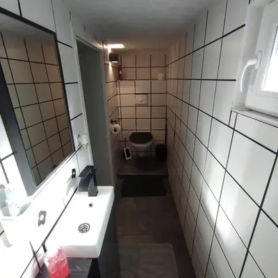 Ein Badezimmer in der Unterkunft Klimatisiertes Ferienhaus am Bauleuteweg 25