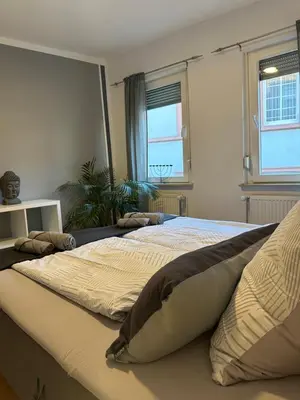 Ein Bett oder Betten in einem Zimmer der Unterkunft Ferienwohnung am Berg