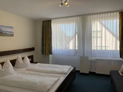 Ein Bett oder Betten in einem Zimmer der Unterkunft Hotel Lindenhof