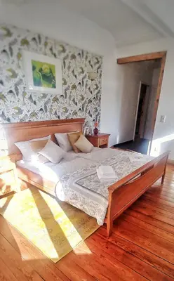 Ein Bett oder Betten in einem Zimmer der Unterkunft Privathotel Der Schwarze Herrgott No TV