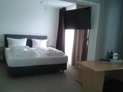 Ein Bett oder Betten in einem Zimmer der Unterkunft Hotel Ackermann