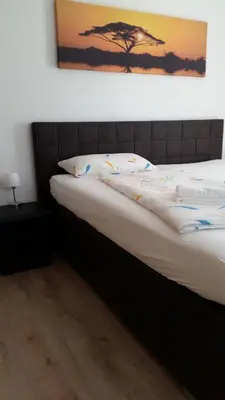 Ein Bett oder Betten in einem Zimmer der Unterkunft Hotel Ackermann