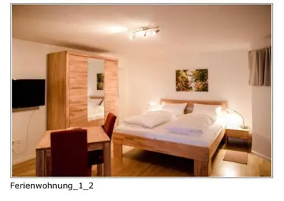 Ein Bett oder Betten in einem Zimmer der Unterkunft Ferienwohnung Wanderlust