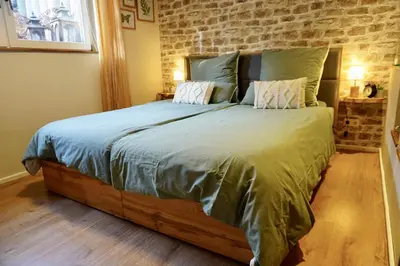 Ein Bett oder Betten in einem Zimmer der Unterkunft Ferienwohnung Palatina - Auszeit in der Südpfalz
