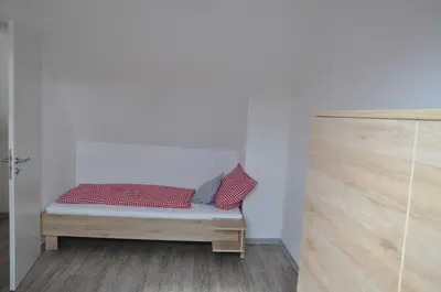 Ein Bett oder Betten in einem Zimmer der Unterkunft Ferienwohnung Vollert