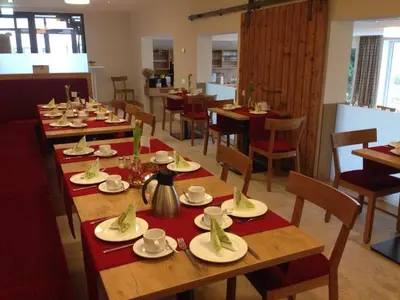Ein Restaurant oder anderes Speiselokal in der Unterkunft Ferienhof Laurentius