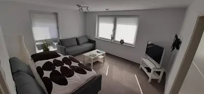 Ein Sitzbereich in der Unterkunft Ferienwohnung Menge