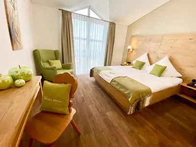Ein Bett oder Betten in einem Zimmer der Unterkunft Hotel Sonnenhof Aspach