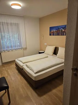 Ein Bett oder Betten in einem Zimmer der Unterkunft Hotel - Restaurant Baumann