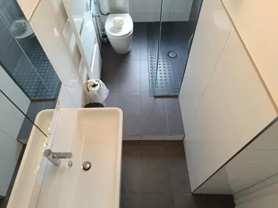 Ein Badezimmer in der Unterkunft Ferienwohnung Forest & Wein