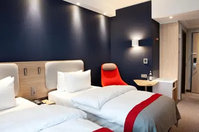 Ein Bett oder Betten in einem Zimmer der Unterkunft Holiday Inn Express - Kaiserslautern by IHG