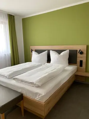 Ein Bett oder Betten in einem Zimmer der Unterkunft Weingut Bugner Meizelhof