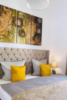 Ein Bett oder Betten in einem Zimmer der Unterkunft Aurum Apartment