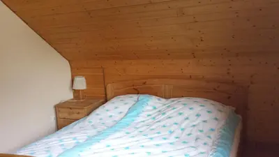 Ein Bett oder Betten in einem Zimmer der Unterkunft Pension Rosenblick