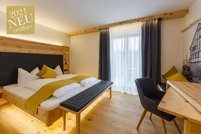 Ein Bett oder Betten in einem Zimmer der Unterkunft Gästehaus Sonnenwirth