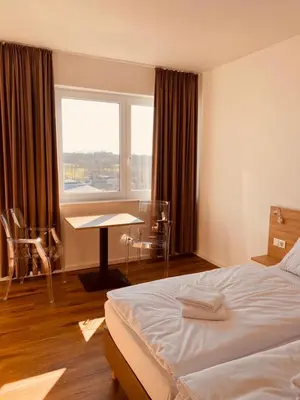 Ein Bett oder Betten in einem Zimmer der Unterkunft Hotel Rodgau