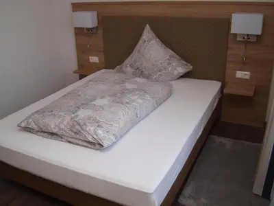 Ein Bett oder Betten in einem Zimmer der Unterkunft Hotel Anker garni