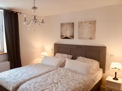 Ein Bett oder Betten in einem Zimmer der Unterkunft Freigeist Ferienwohnungen