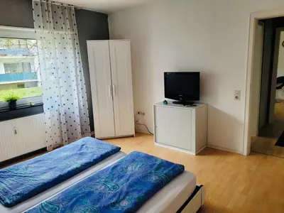 Ein Bett oder Betten in einem Zimmer der Unterkunft Appartment in Walldorf mit Schlafzimmer, Küche und Bad