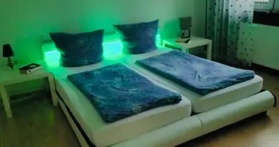 Ein Bett oder Betten in einem Zimmer der Unterkunft Appartment in Walldorf mit Schlafzimmer, Küche und Bad