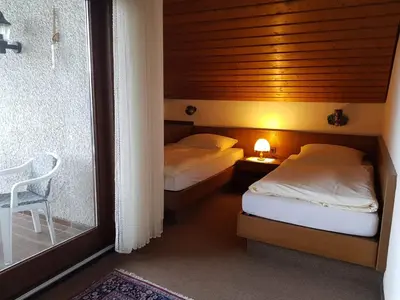 Ein Bett oder Betten in einem Zimmer der Unterkunft Haus Talblick