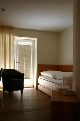 Ein Bett oder Betten in einem Zimmer der Unterkunft Rieslinghof
