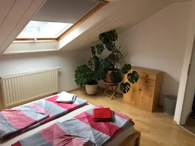 Ein Bett oder Betten in einem Zimmer der Unterkunft Ferienwohnung Heidelberg ZE-2020-7-WZ